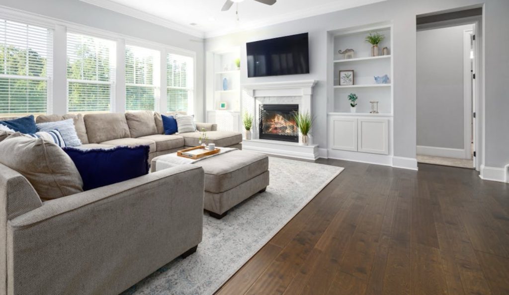 Living room with combination of hardwood and vinyl flooring